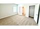 Spacious bedroom with plush carpet, closet, and natural light at 114 Southern Estates Dr, Sanford, NC 27330