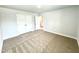 Comfortable carpeted bedroom with a closet and access to other rooms at 114 Southern Estates Dr, Sanford, NC 27330
