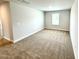 Bright bedroom offers soft carpeting and natural lighting from window at 114 Southern Estates Dr, Sanford, NC 27330