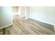 Inviting hallway showcases hardwood flooring with a view into the dining room at 114 Southern Estates Dr, Sanford, NC 27330