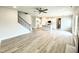 Bright, open-concept living space flowing into the kitchen, featuring hardwood floors and modern finishes at 114 Southern Estates Dr, Sanford, NC 27330