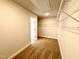 Spacious walk-in closet with wire shelving; overhead lighting and neutral carpet at 114 Southern Estates Dr, Sanford, NC 27330