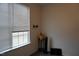Bright bedroom with window, plant, and TV at 1850 Gillburg Road, Henderson, NC 27537