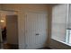 Bedroom with closet and view into another room at 1850 Gillburg Road, Henderson, NC 27537