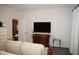Bedroom with TV, dresser, and adjacent bathroom at 1850 Gillburg Road, Henderson, NC 27537