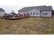 Home's back deck with seating and yard view at 1850 Gillburg Road, Henderson, NC 27537