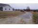 Long paved driveway leading to a single-Gathering home at 1850 Gillburg Road, Henderson, NC 27537