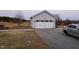 Detached garage with double door and additional parking at 1850 Gillburg Road, Henderson, NC 27537