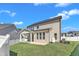 Backyard of house, featuring an outdoor seating area, lush grass, and great view of the home's architecture at 9113 Dupree Meadow Dr # 41, Angier, NC 27501