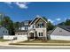 Charming two-story home with a two-car garage, manicured lawn and delightful curb appeal at 9113 Dupree Meadow Dr # 41, Angier, NC 27501
