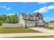 Attractive two-story home with a well-manicured lawn, an attached two-car garage, and a white picket fence at 9113 Dupree Meadow Dr # 41, Angier, NC 27501
