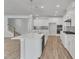 Open kitchen with an island and stainless appliances flows seamlessly into the dining and living areas at 9113 Dupree Meadow Dr # 41, Angier, NC 27501