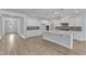 Bright kitchen with an island, stainless appliances, white cabinets, and stylish backsplash at 9113 Dupree Meadow Dr # 41, Angier, NC 27501
