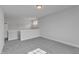 Spacious open loft area with gray carpeting, natural light, and railing feature at 9113 Dupree Meadow Dr # 41, Angier, NC 27501