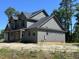 New construction home featuring a gray exterior, covered porch, dormer, and black framed windows at 133 Slocum Ct, Wendell, NC 27591