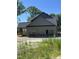 New home featuring a rear-entry garage, covered porch and horizontal siding at 133 Slocum Ct, Wendell, NC 27591