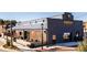 Exterior view of Bearded Bee Brewing Co. with outdoor patio seating and a glimpse of the building's brickwork at 218 Sweetbay Tree Dr, Wendell, NC 27591