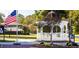 Charming gazebo in Wendell Town Square with an American Flag in the background at 218 Sweetbay Tree Dr, Wendell, NC 27591