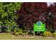 View of Wendell Park Sign with bright green color, surrounded by lush green trees and foliage at 218 Sweetbay Tree Dr, Wendell, NC 27591