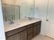 Bathroom featuring double sinks, gray cabinets, and a large mirror at 32 Furley St., Homesite 53, Sanford, NC 27330