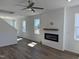 Bright living room featuring a modern fireplace, laminate floors, and recessed lighting at 32 Furley St., Homesite 53, Sanford, NC 27330