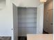 A view of a pantry with white shelving and white paint on the doors and trim at 32 Furley St., Homesite 53, Sanford, NC 27330