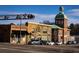 Street view shows storefronts with a Coca-Cola sign, rail crossing and a domed building in the background at 32 Furley St., Homesite 53, Sanford, NC 27330