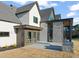 Outdoor patio with built-in grill and fireplace, adjacent to modern home at 9009 Meadow Pointe Ct, Wake Forest, NC 27587