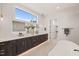 Modern bathroom with double vanity and soaking tub at 9009 Meadow Pointe Ct, Wake Forest, NC 27587