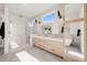 Luxurious bathroom with double vanity, large walk-in shower, and a soaking tub at 9009 Meadow Pointe Ct, Wake Forest, NC 27587