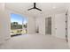 Bright bedroom with large window and ceiling fan at 9009 Meadow Pointe Ct, Wake Forest, NC 27587