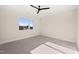 Well-lit bedroom with a window and ceiling fan at 9009 Meadow Pointe Ct, Wake Forest, NC 27587