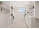 Spacious walk-in closet with custom shelving at 9009 Meadow Pointe Ct, Wake Forest, NC 27587