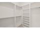 Bright white built-in shelving and hanging space at 9009 Meadow Pointe Ct, Wake Forest, NC 27587