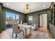 Elegant home office with green walls, gold accents, and hardwood floors at 9009 Meadow Pointe Ct, Wake Forest, NC 27587