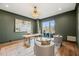 Sophisticated home office with green walls and built-in shelves at 9009 Meadow Pointe Ct, Wake Forest, NC 27587