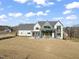 Contemporary home exterior showcasing a stylish design and spacious backyard at 9009 Meadow Pointe Ct, Wake Forest, NC 27587