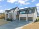 Modern home with attached garage and landscaping at 9009 Meadow Pointe Ct, Wake Forest, NC 27587