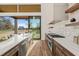 Modern kitchen with white quartz countertops and stainless steel appliances at 9009 Meadow Pointe Ct, Wake Forest, NC 27587