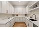 White kitchen with quartz countertops and gold hardware at 9009 Meadow Pointe Ct, Wake Forest, NC 27587