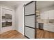 Butler's pantry with white shaker cabinets and a metal door at 9009 Meadow Pointe Ct, Wake Forest, NC 27587