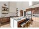 Modern kitchen with large island and high-end appliances at 9009 Meadow Pointe Ct, Wake Forest, NC 27587