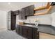 Modern laundry room with dark wood cabinets at 9009 Meadow Pointe Ct, Wake Forest, NC 27587