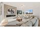 Sunlit living room featuring a modern fireplace and large windows at 9009 Meadow Pointe Ct, Wake Forest, NC 27587
