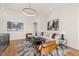 Bright living room featuring modern decor, stylish seating, and natural light at 9009 Meadow Pointe Ct, Wake Forest, NC 27587