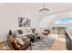 Bright and airy living area features a neutral palette and large windows offering scenic views at 9009 Meadow Pointe Ct, Wake Forest, NC 27587
