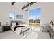 Spacious main bedroom with large windows, a comfortable bed, and a view of the backyard at 9009 Meadow Pointe Ct, Wake Forest, NC 27587
