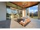 Covered patio features comfortable seating and views of the backyard at 9009 Meadow Pointe Ct, Wake Forest, NC 27587