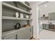 Walk-in pantry with green cabinets and shelving at 9009 Meadow Pointe Ct, Wake Forest, NC 27587