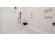 Walk-in shower with built-in shelving and seat at 9009 Meadow Pointe Ct, Wake Forest, NC 27587